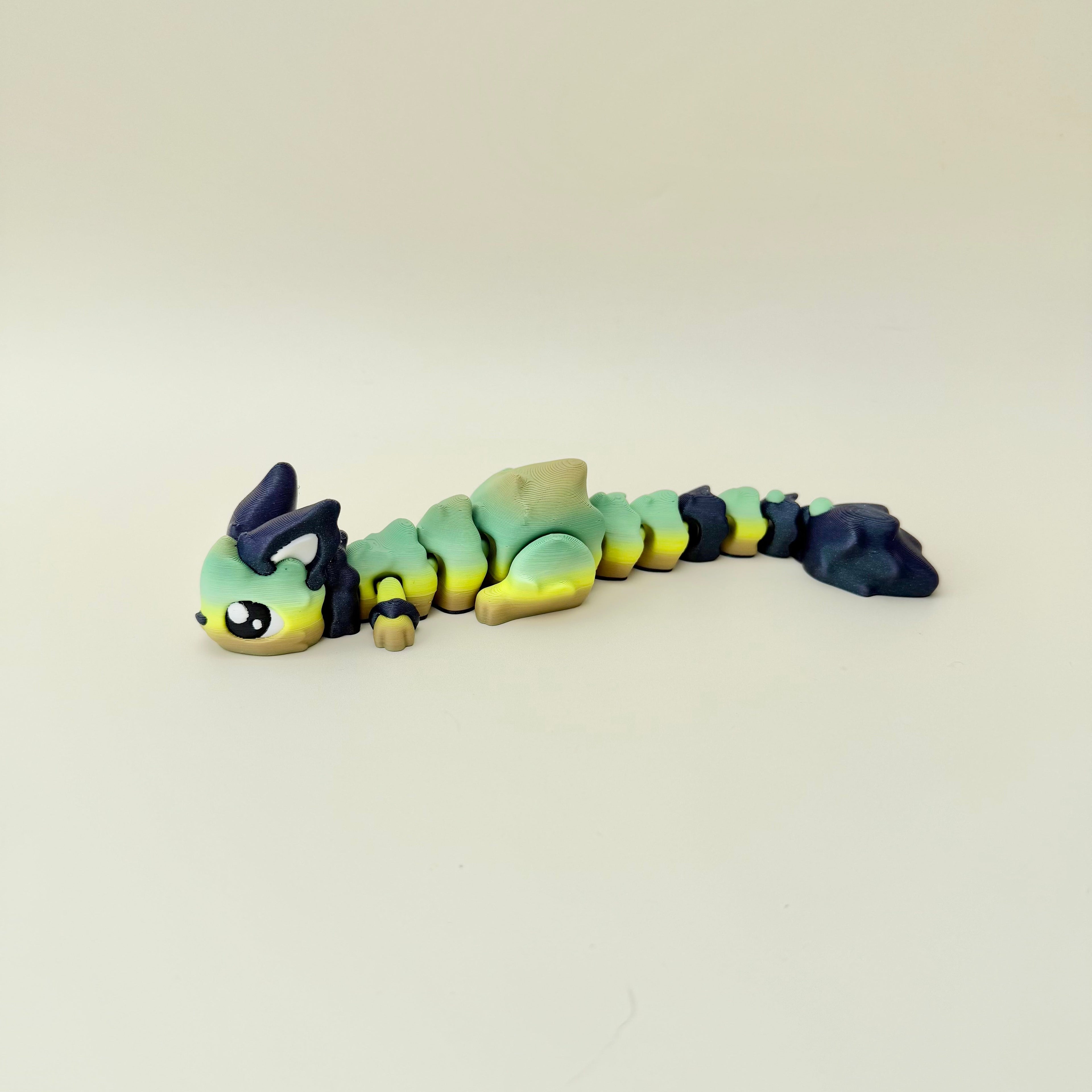 Fantasy creature fidget with a bendy body, textured finish and collectible desk-friendly design.
