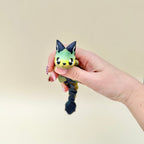 Mythical creature sensory toy with tactile details and flexible movement for focus breaks and stimming.
