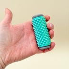 Pressure-based sensory roller for stimming, grounding and managing restless hands.
