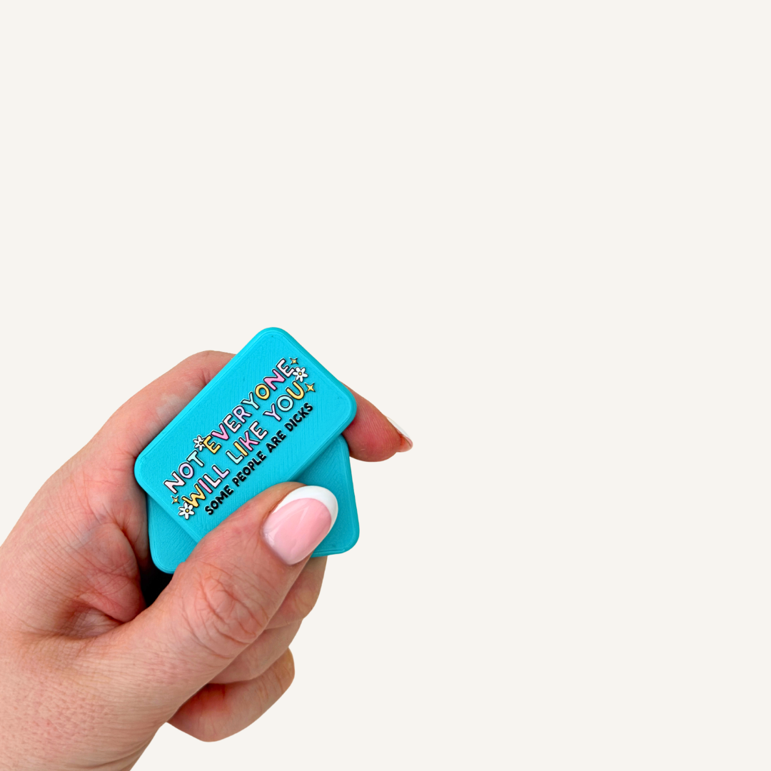 Two blue pocket-sized magnetic fidgets designed to snap, twist and move together