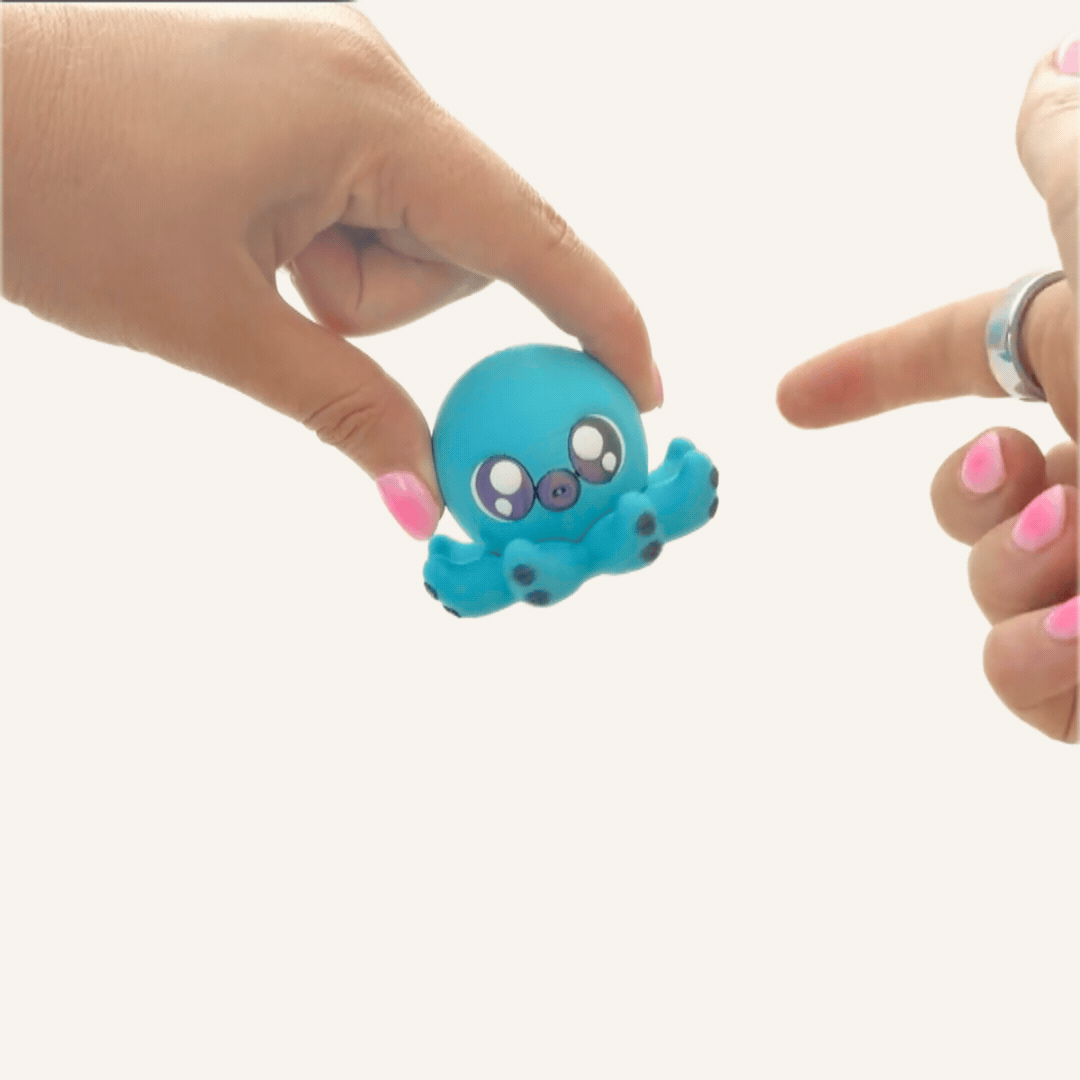Turquoise octopus sensory spinner with colour-change finish and repetitive movement for focus support.