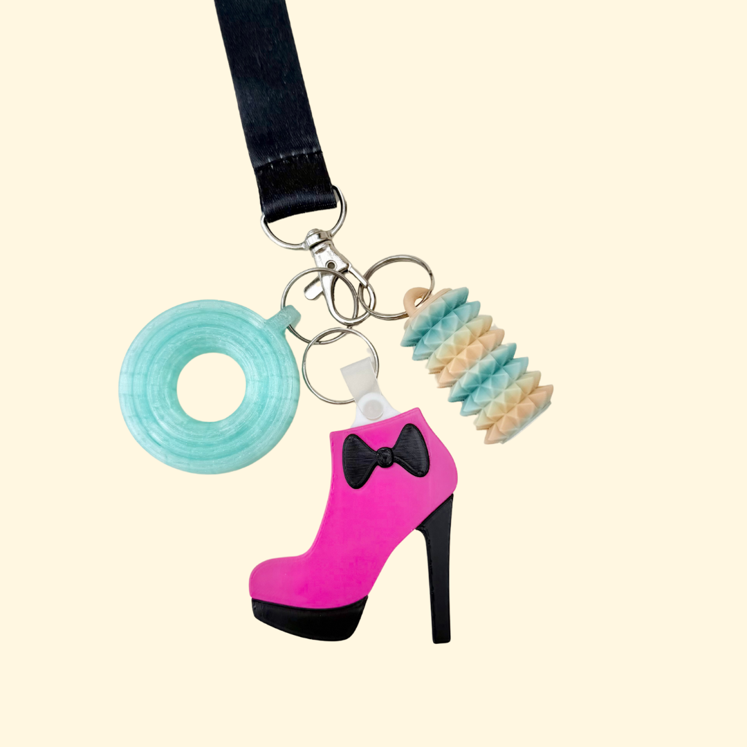 Discreet keyring add-on for bags and coats, designed for fast contact or map access when you need help quickly.
