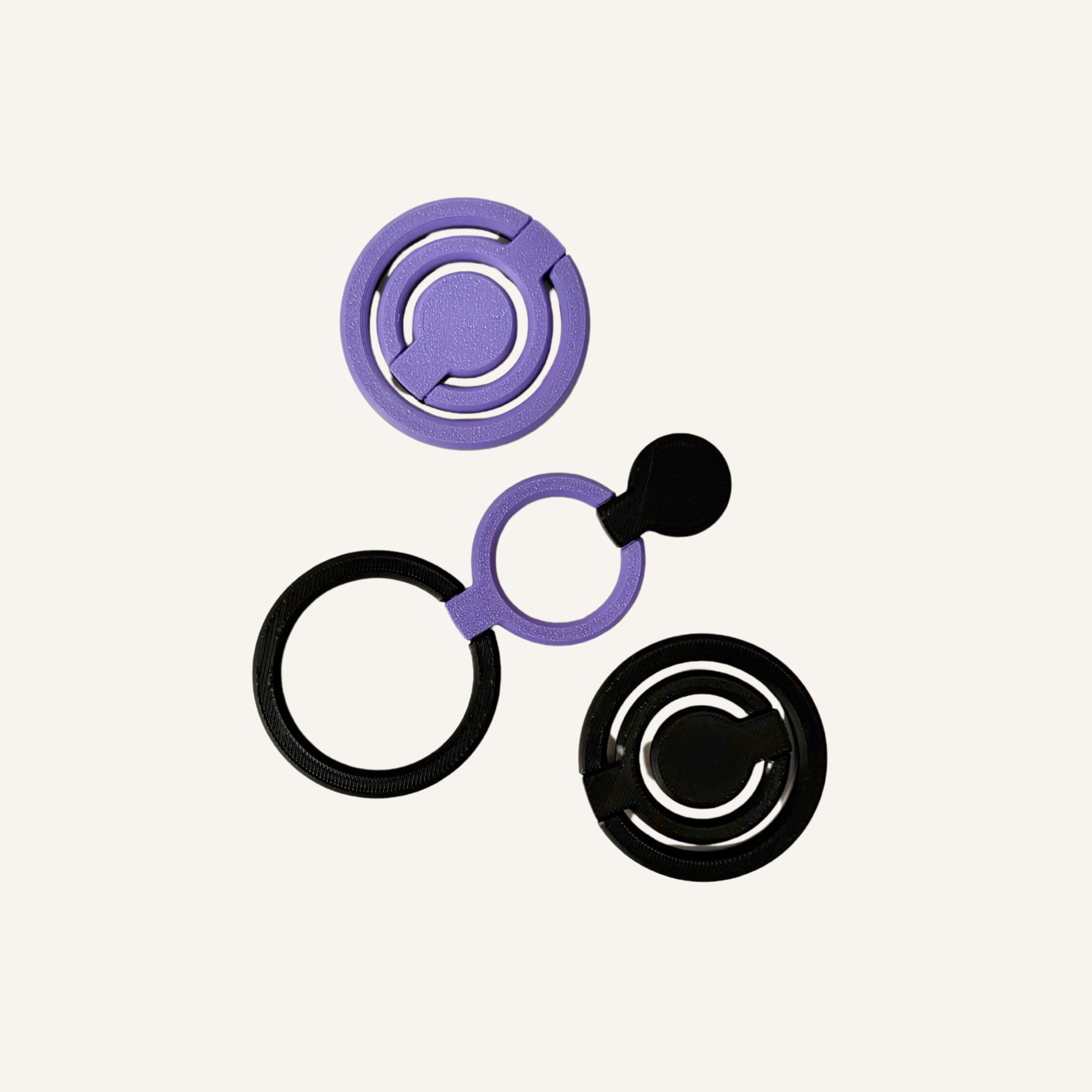 Pocket-sized flip fidget with rotating linked rings for one or two-handed play.