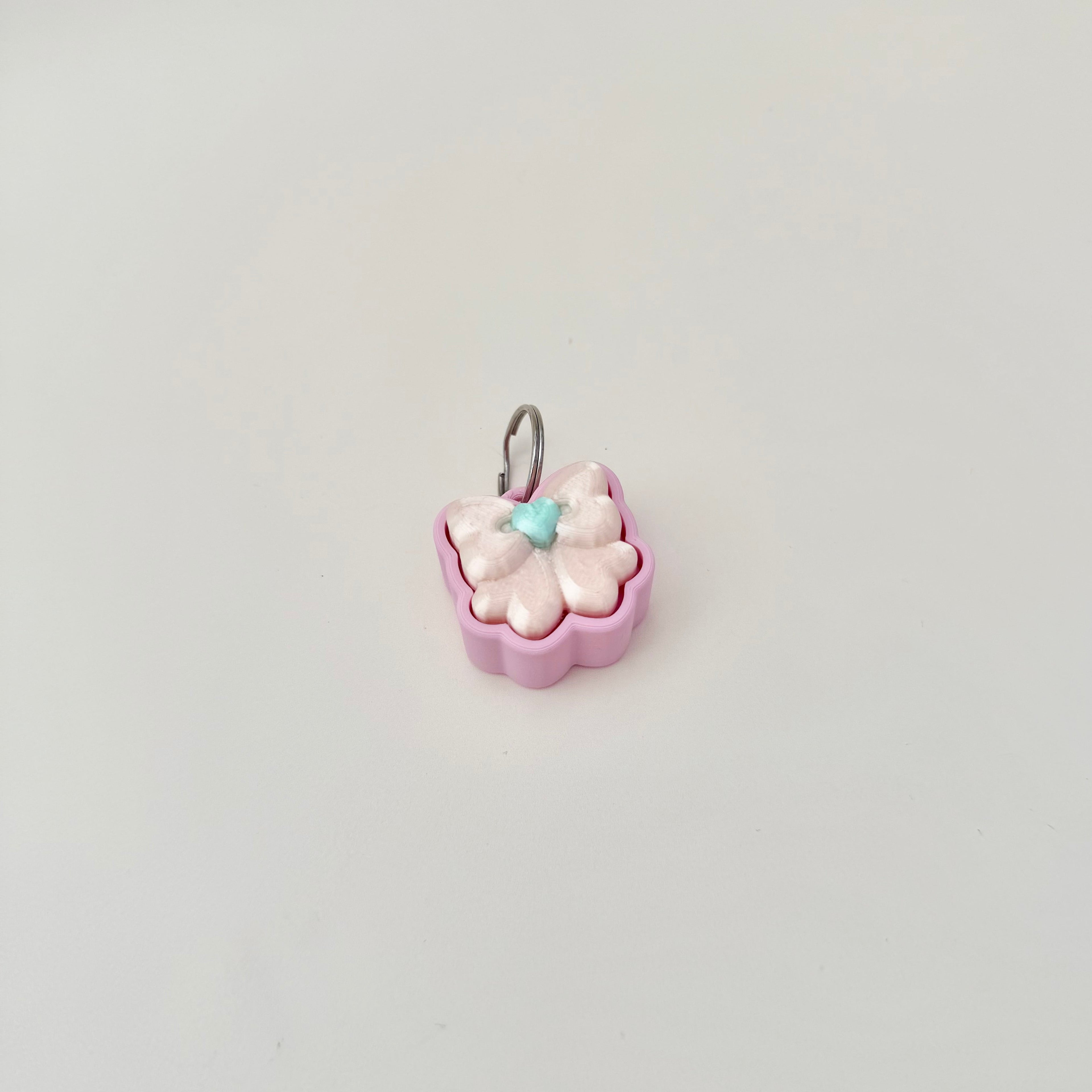 compact pastel clicker with press action, suitable for discreet handheld stimming
