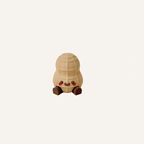 Cute mini peanut character with dangling legs designed for desks, shelves and discreet calming decor spaces

