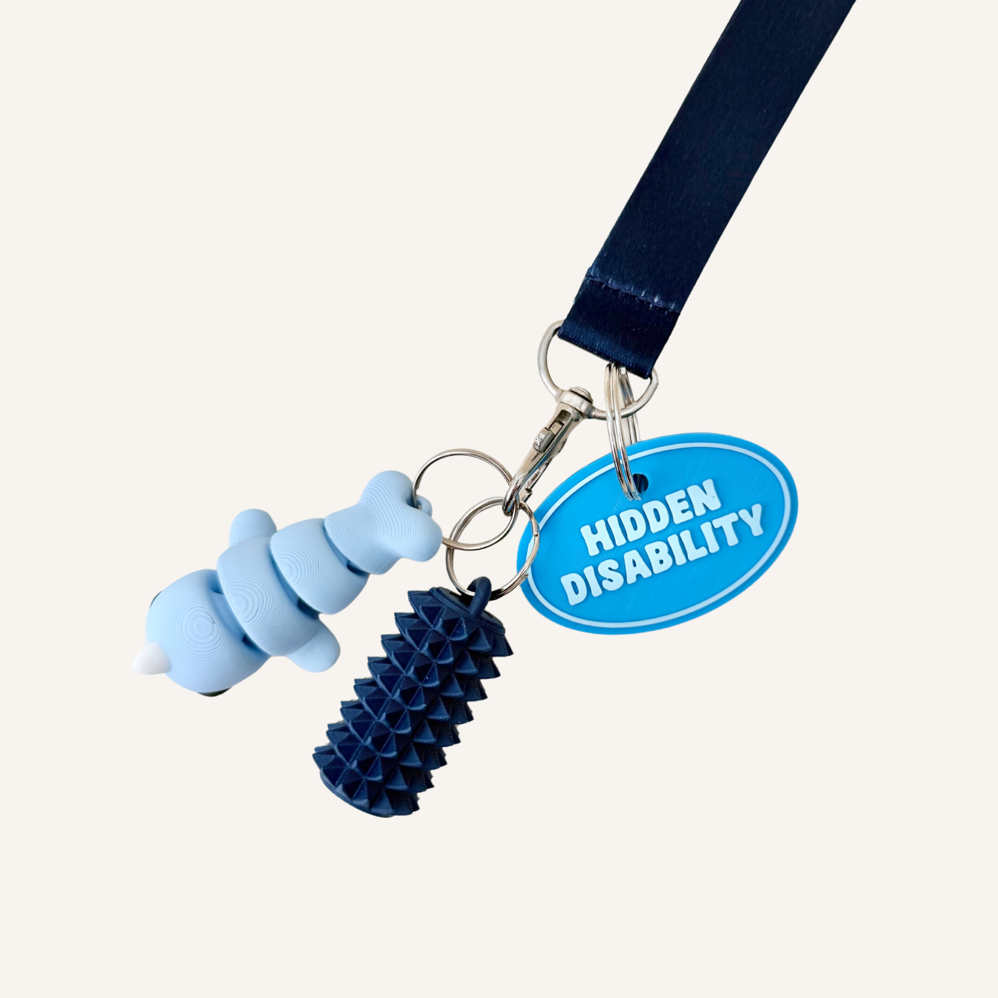 Oval 3D printed tag with raised wording and silver loop for visible everyday identity support.