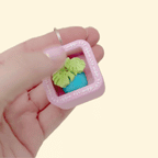 A small carry-along clicker fidget designed to attach to keys, bags or lanyards.
