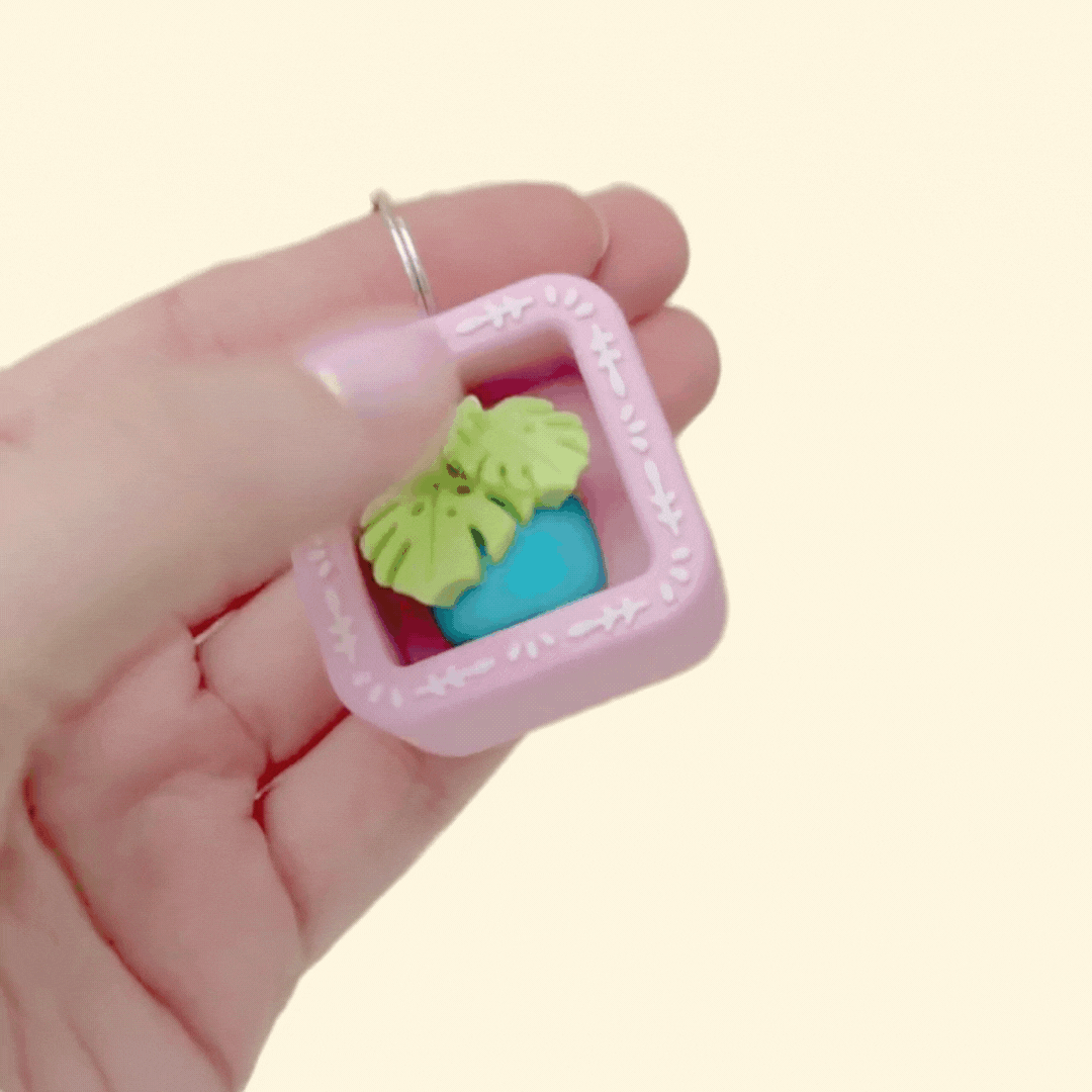 A small carry-along clicker fidget designed to attach to keys, bags or lanyards.
