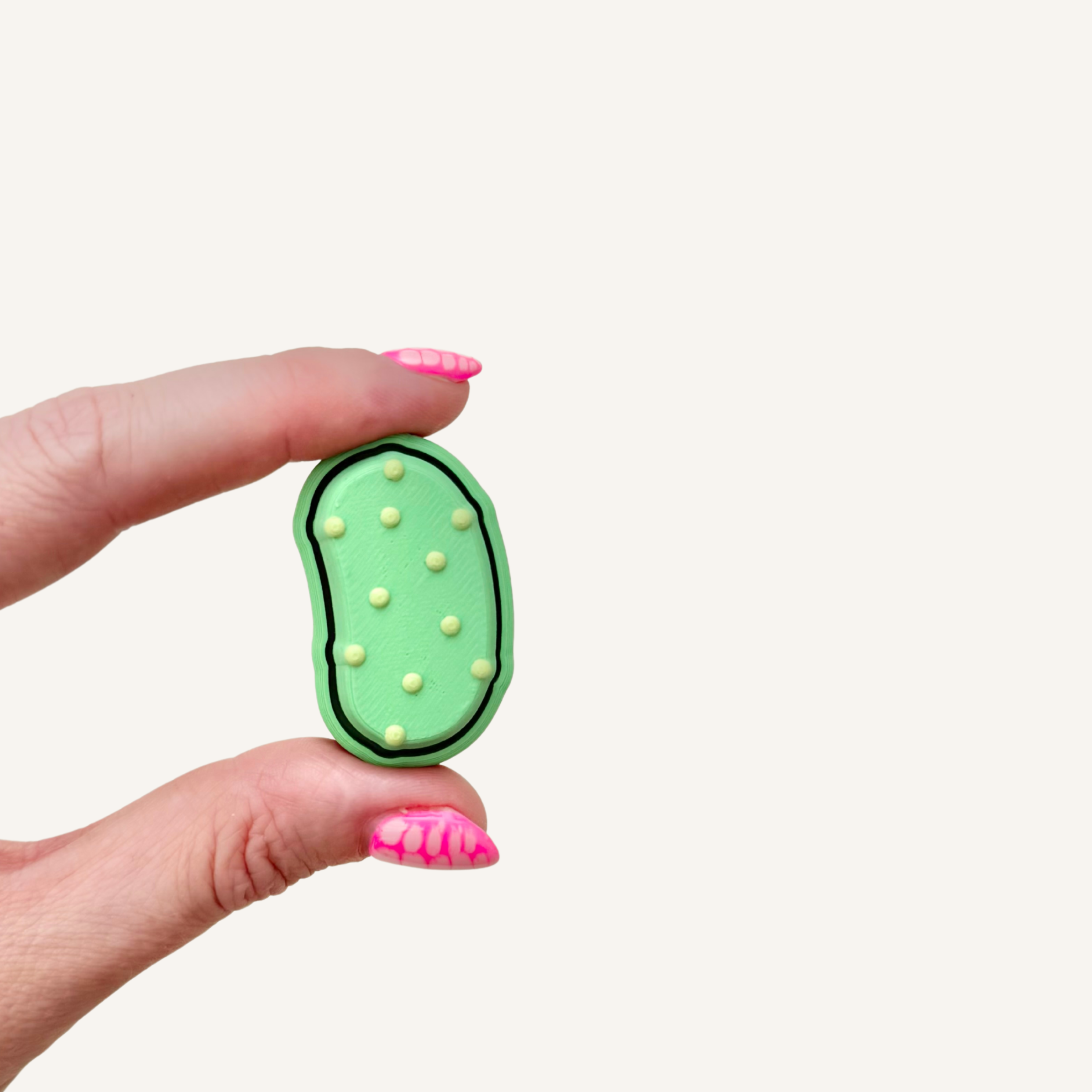 Realistic pickle-shaped sensory clicker with tactile detail and satisfying click feedback.