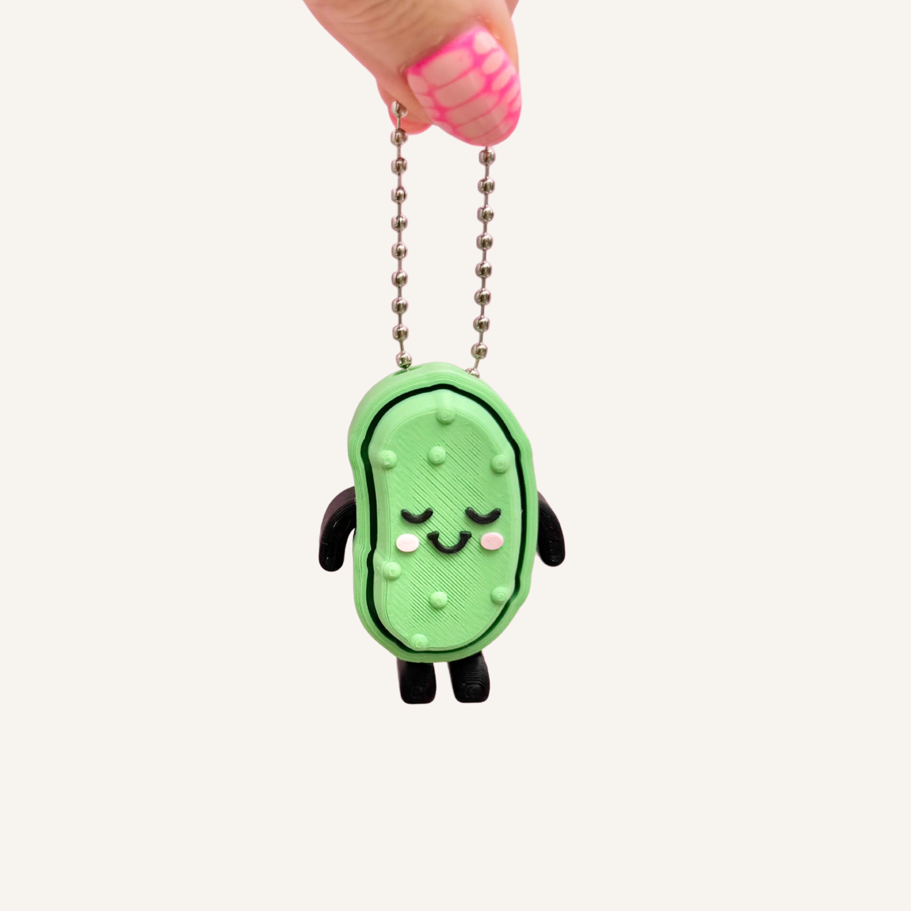 Pickle-shaped desk fidget with satisfying click feedback for everyday sensory use.