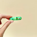 A fun and quirky one-eyed pickle fidget toy, ideal for pickle fans and collectors.