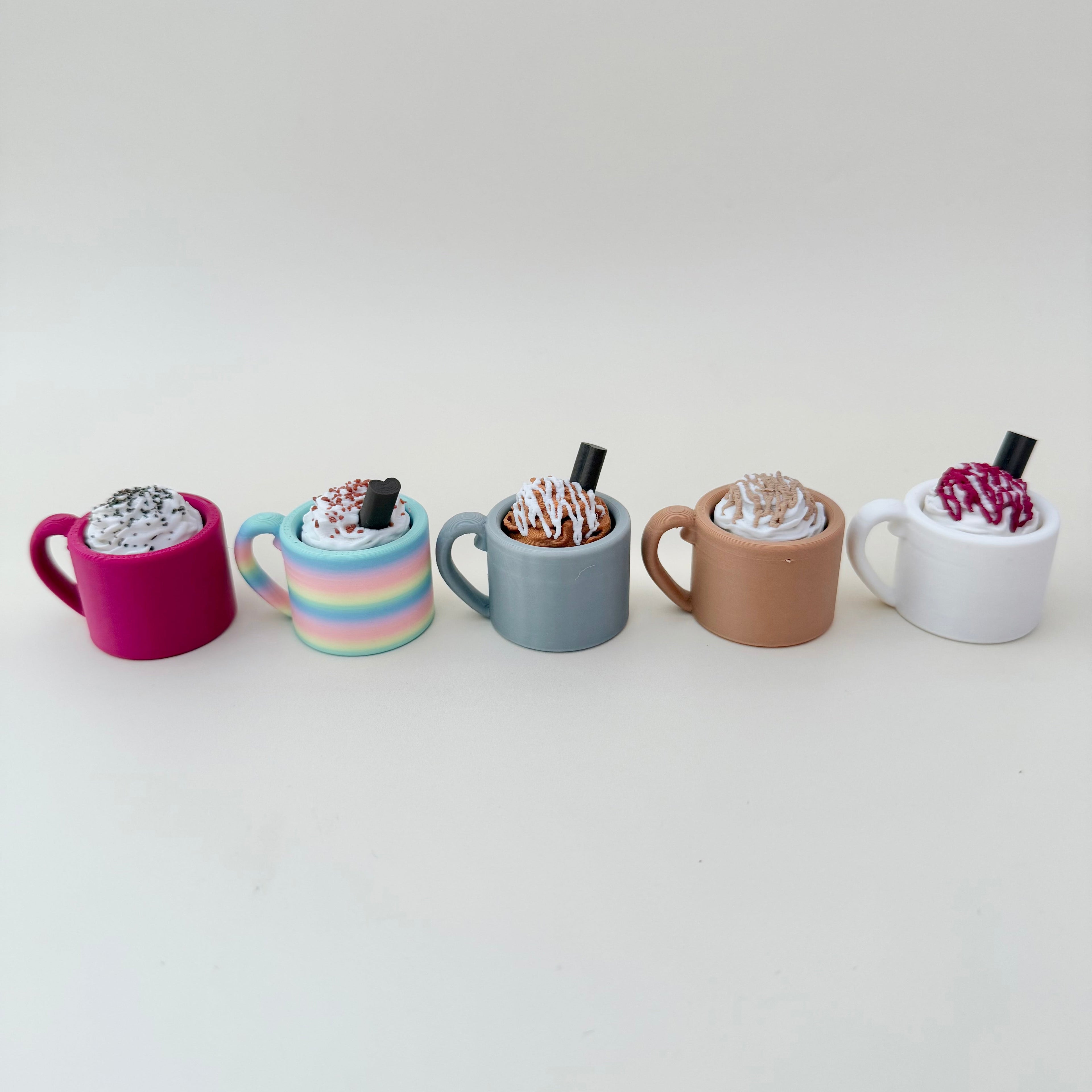 Compact plum-coloured mug clicker with tactile cream swirl for calm stimming.
