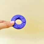 Compact bubble-pop style fidget ring with press-through buttons for satisfying, repeatable popping and tactile input.

