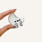 Mini moon figure with smooth finish and sit-anywhere legs for bedside tables, dashboards and shelves
