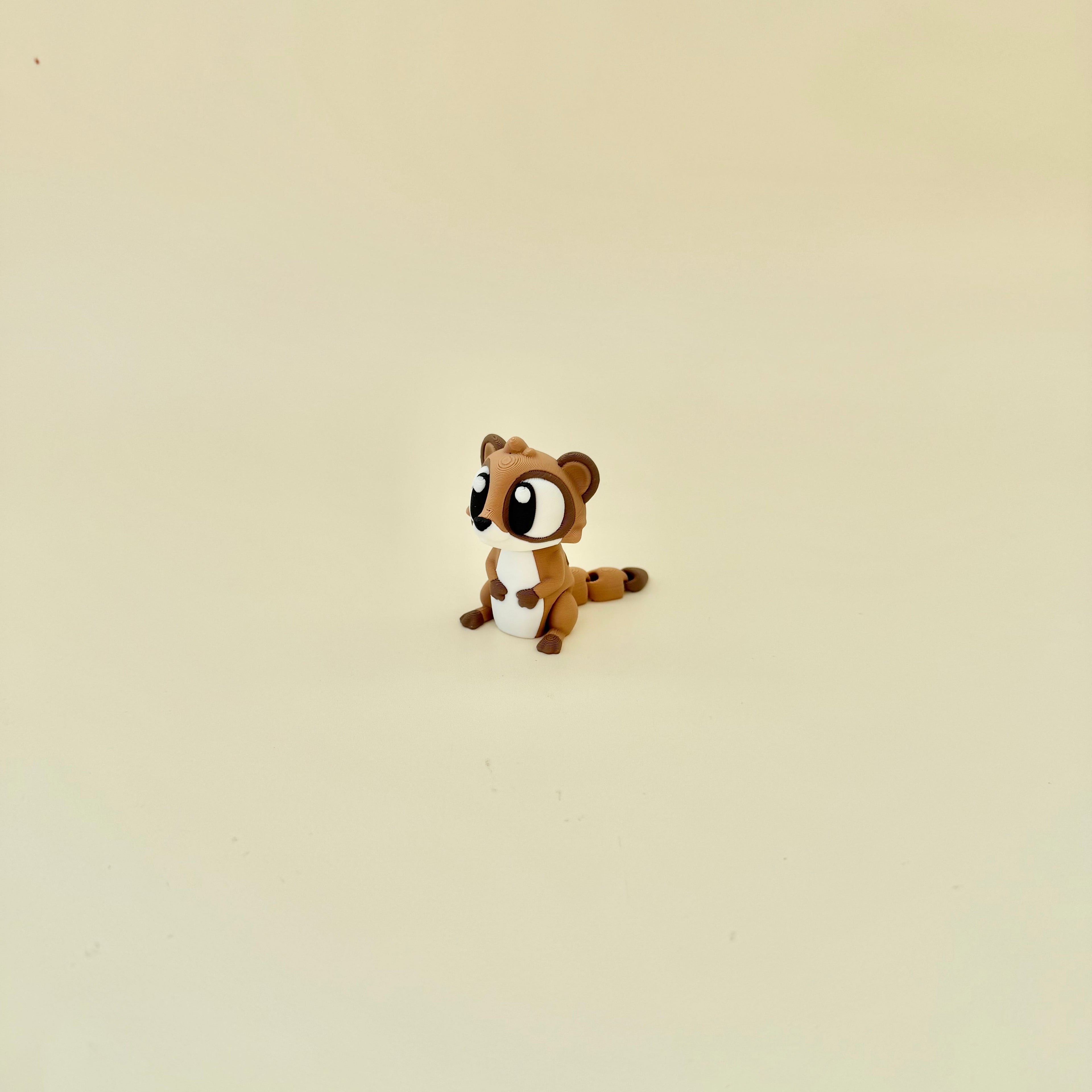 Cute pocket animal fidget with flexible tail movement and tactile feedback for focus support.