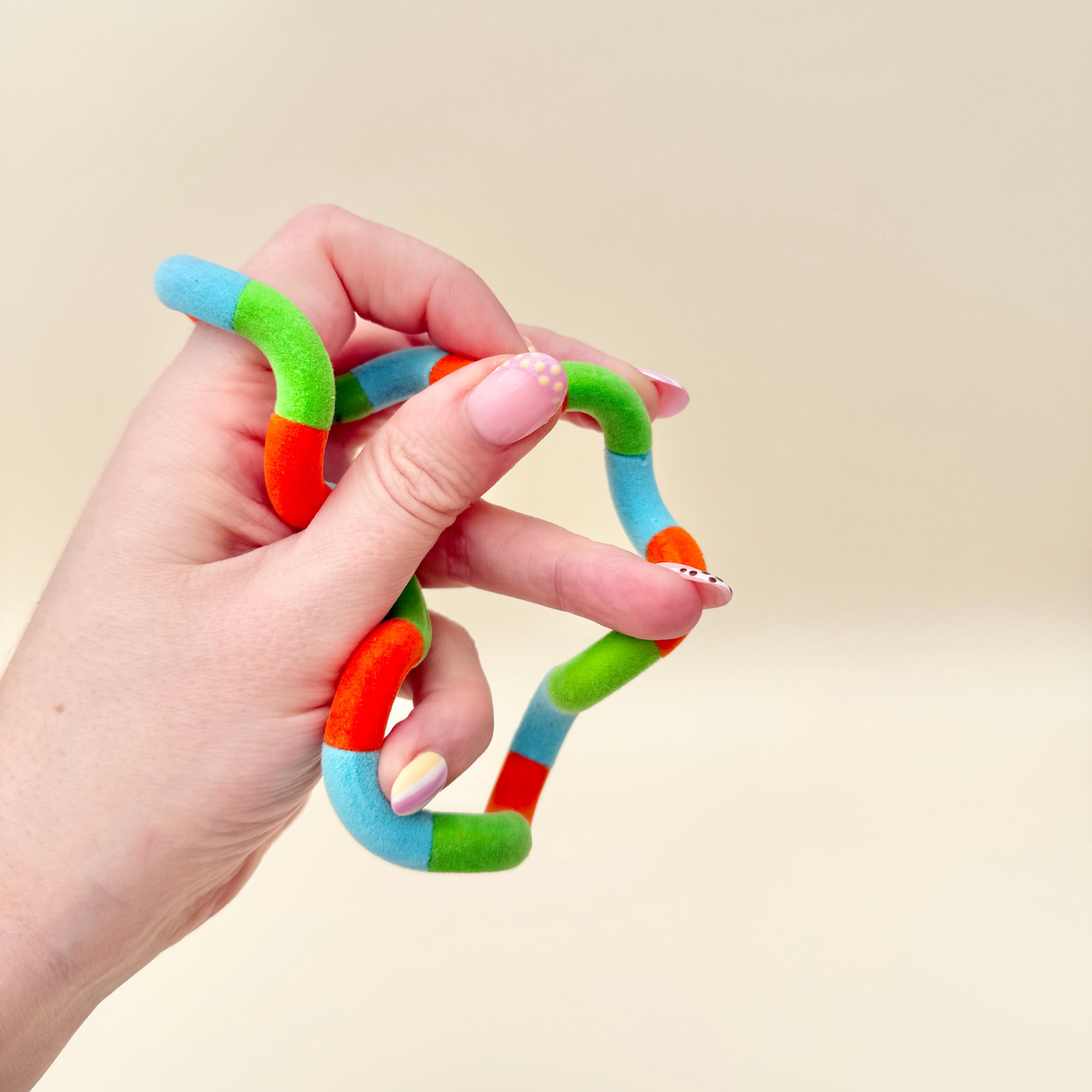 Compact junior-size twist fidget with fuzzy finish, low distraction and easy to carry for on-the-go stimming.
