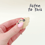 Compact dumpling style magnet fidget toy designed for continuous swinging motion and tactile sensory stimulation.
