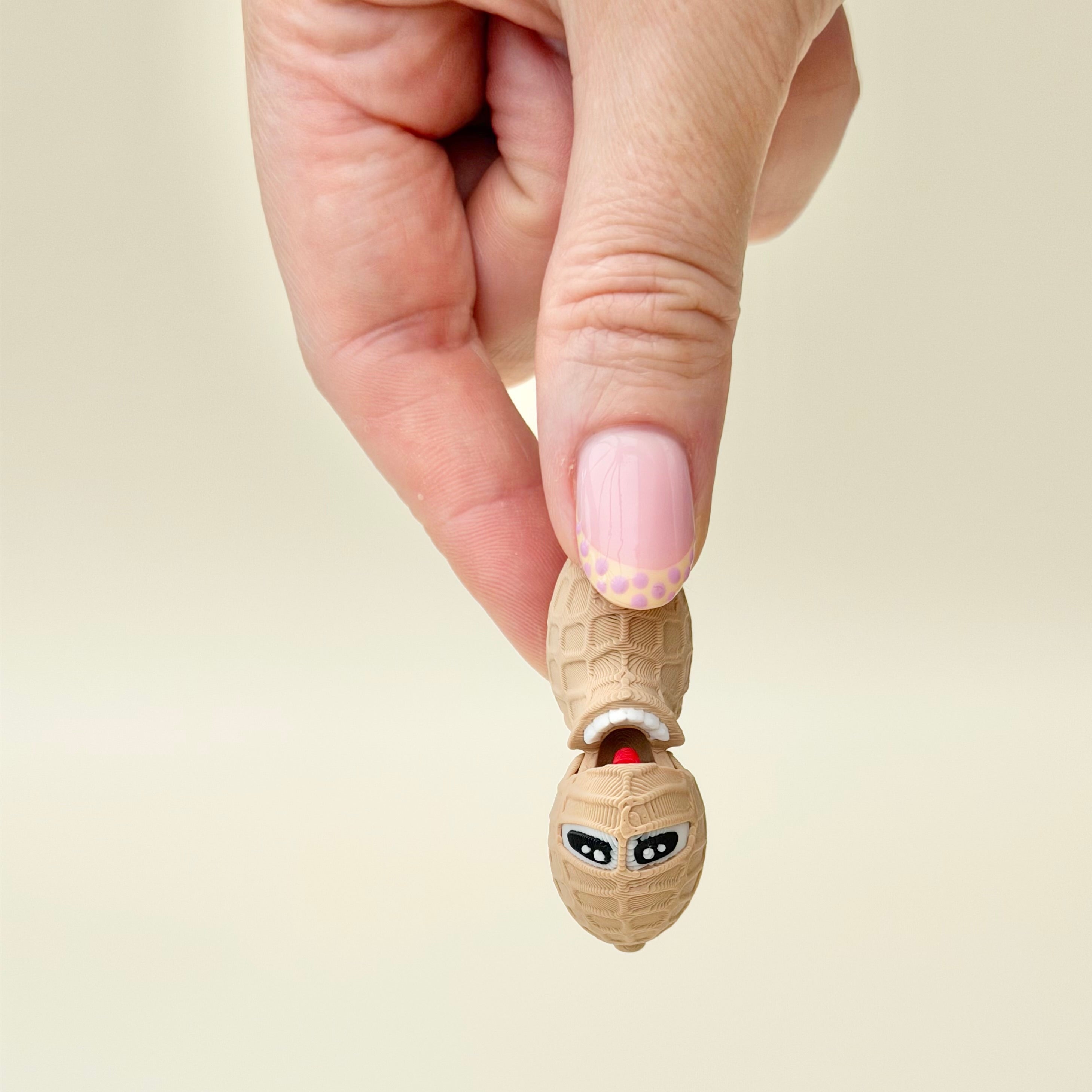 Lightweight handheld fidget designed for casual use, humour, and low-effort sensory engagement.
