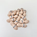Cute articulated peanut figure that doubles as a playful desk item and simple repetitive fidget.
