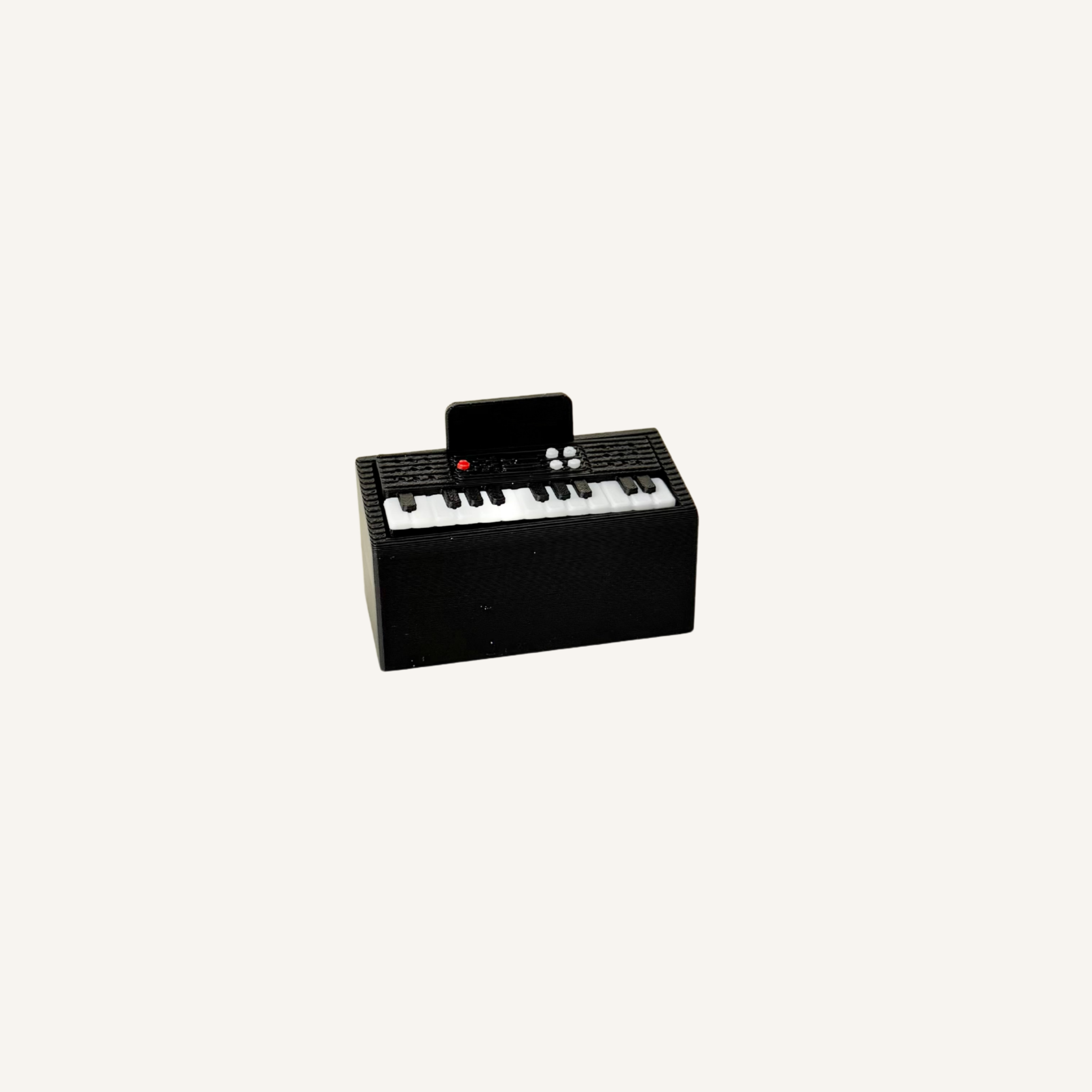 Mini piano clicker fidget with tactile push keys designed for focus, sensory regulation and repetitive hand movement.
