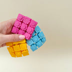Handheld pop fidget with satisfying push feedback for stimming and stress relief.
