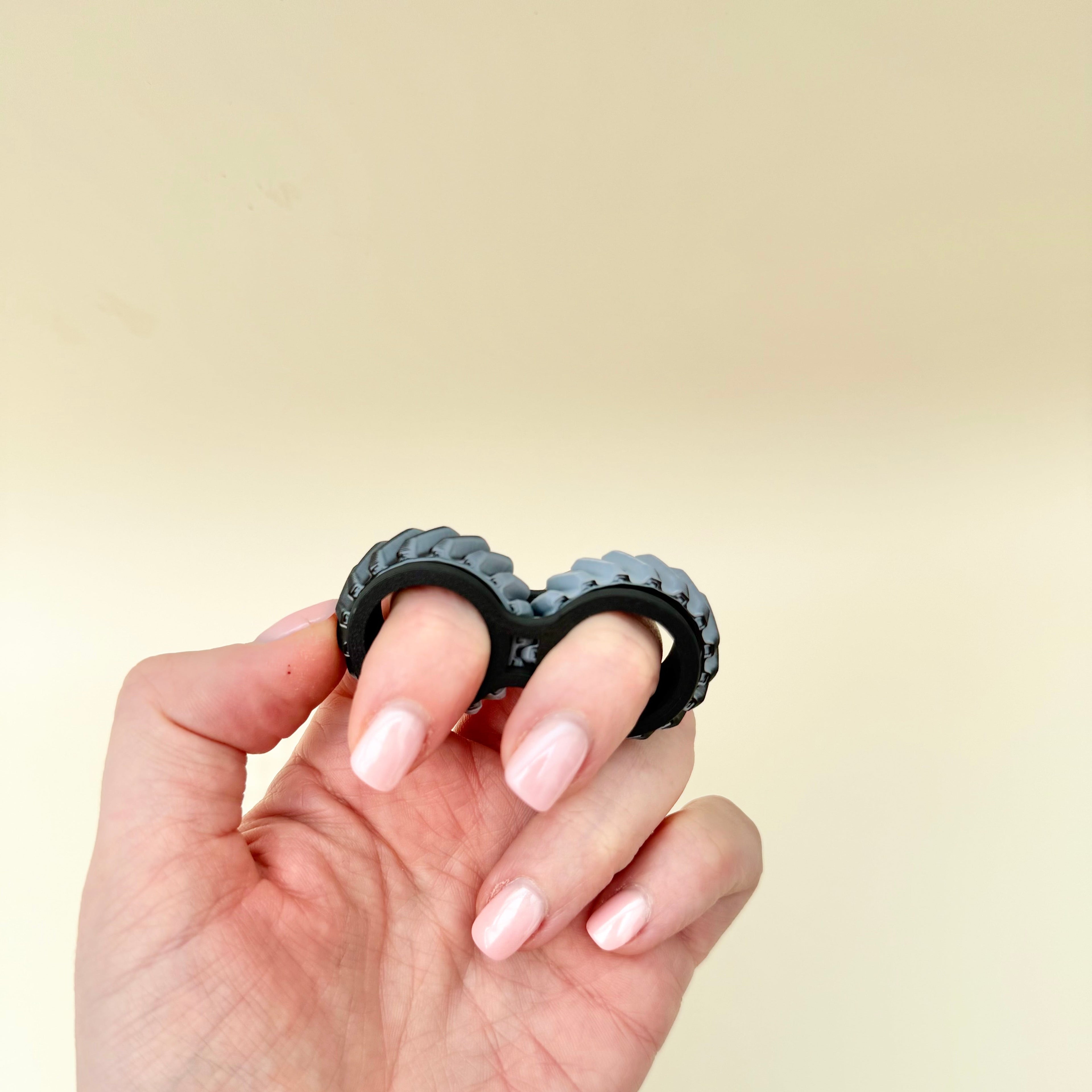 Small pocket fidget with smooth repetitive movement, tactile ridged wheels and custom colour options.