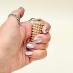 Textured spiky add-on for lanyards and keyrings, designed for tactile stimming, grounding and everyday regulation.
