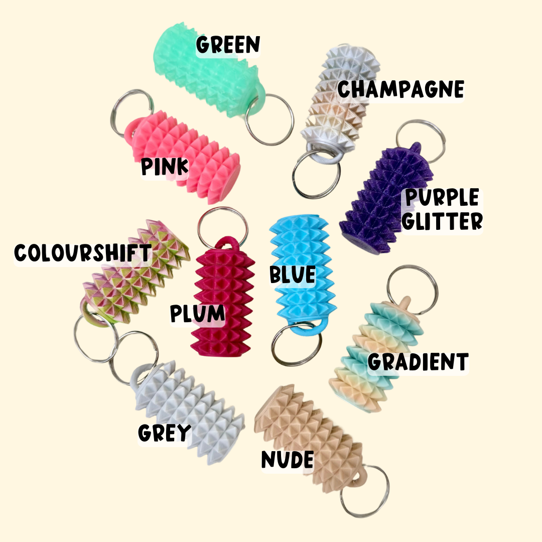 Small spiked sensory fidget for pressure-based stimming and regulation, easy to grab without making noise.
