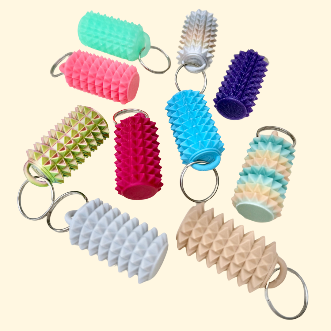 Compact spiky sensory fidget add-on for lanyards and keyrings, designed for tactile input, grounding and discreet stimming.
