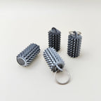 Textured pocket-sized fidget designed for squeezing, pressing, and tactile regulation.