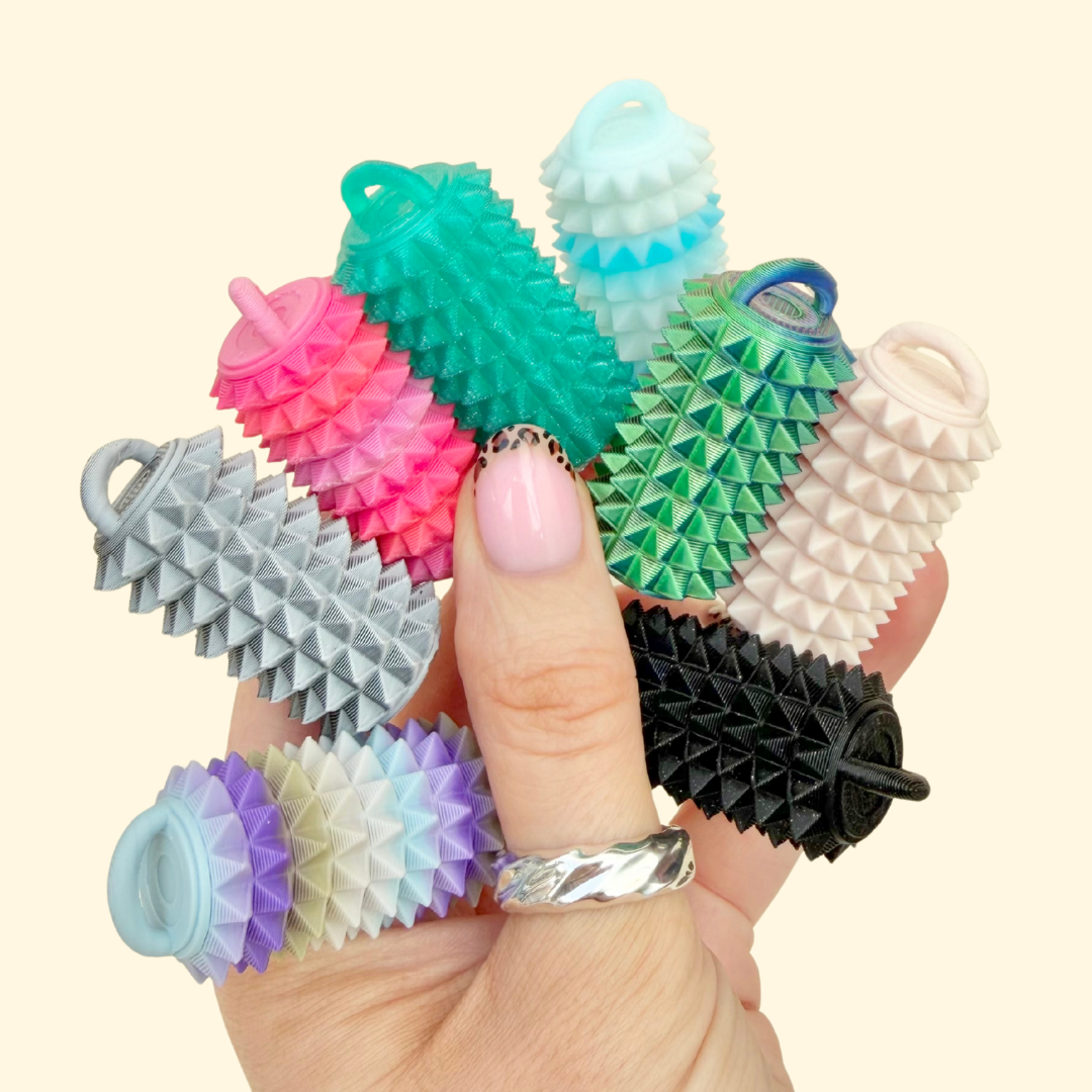 Compact textured sensory roller for grounding, tactile input and discreet stimming, pocket-sized and easy to carry.
