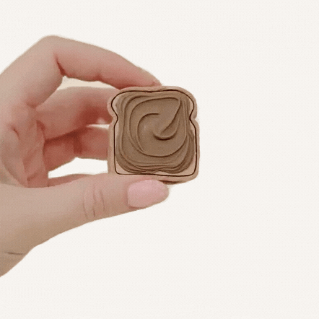 Small handheld toast fidget for stress relief, stimming and everyday busy hands support.
