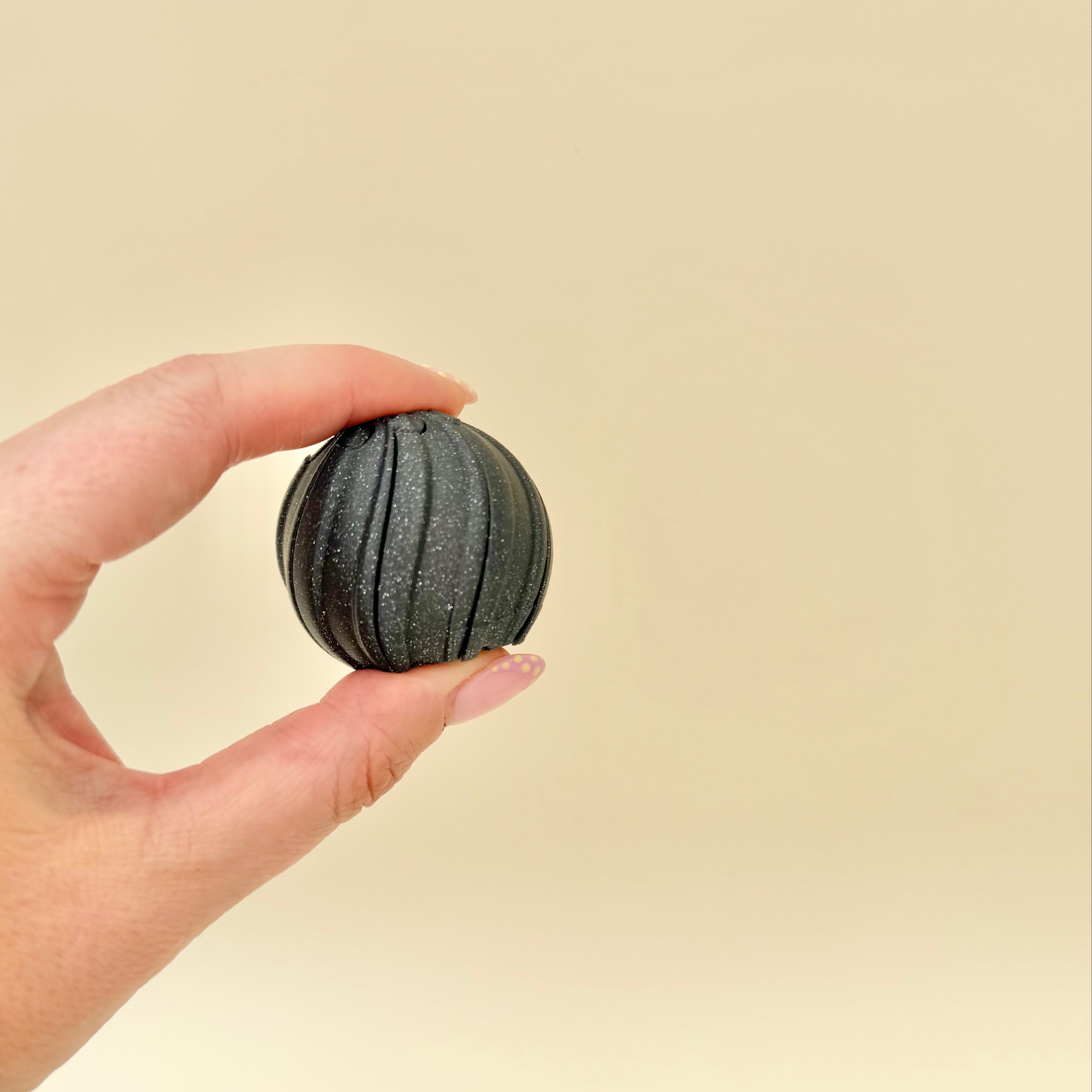 Compact handheld twist fidget with corkscrew movement designed for sensory input and focus support.
