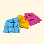 Square pop and press fidget with push-through buttons for repetitive sensory stimulation.
