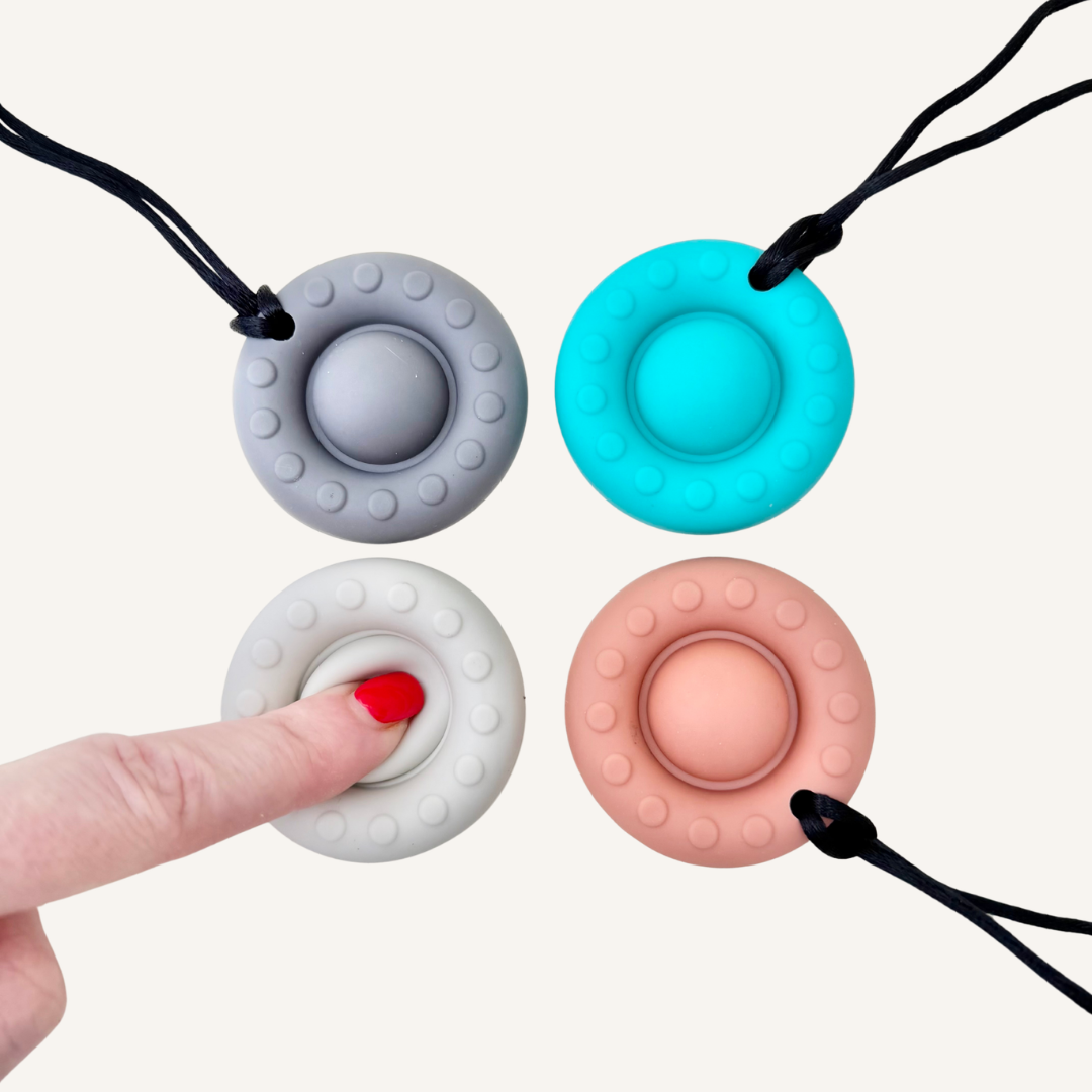 Silicone chew stim with a circular shape and fidget-style centre for everyday oral sensory regulation.
