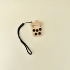 Portable popback fidget with bubble press feedback and wrist strap for everyday sensory use.
