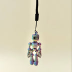 Small robot stim toy with flexible joints, wrist strap attachment and repetitive movement for focus support.