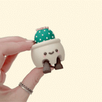 Kawaii-style plant pot sensory clicker with movable legs, display-ready décor look with a satisfying click.
