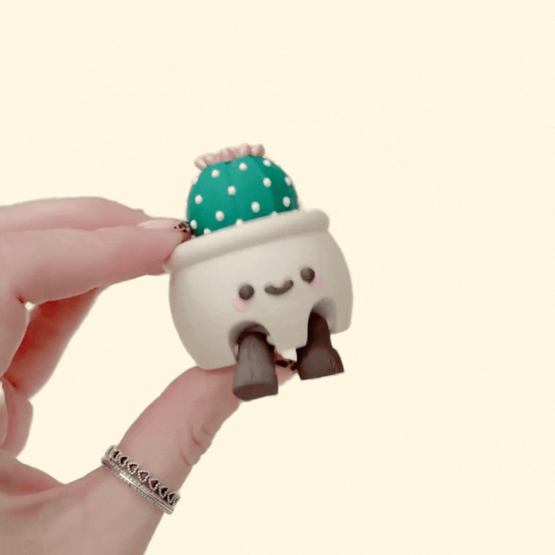 Kawaii-style plant pot sensory clicker with movable legs, display-ready décor look with a satisfying click.

