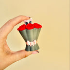 Handheld clicker with controlled resistance for grounding and focus.
