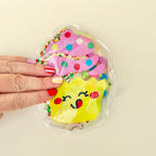 Handheld sensory fidget that moves and swirls when pressed for relaxing and engaging sensory play.
