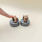 Compact press-click fidget for stress relief and calming stims for ADHD and autism sensory needs.
