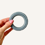 Handheld sensory roller with rotating centre and tactile Spikz texture for everyday fidgeting.