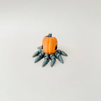 Realistic-style pumpkin octopus designed for smooth, bendy motion on a desk.
