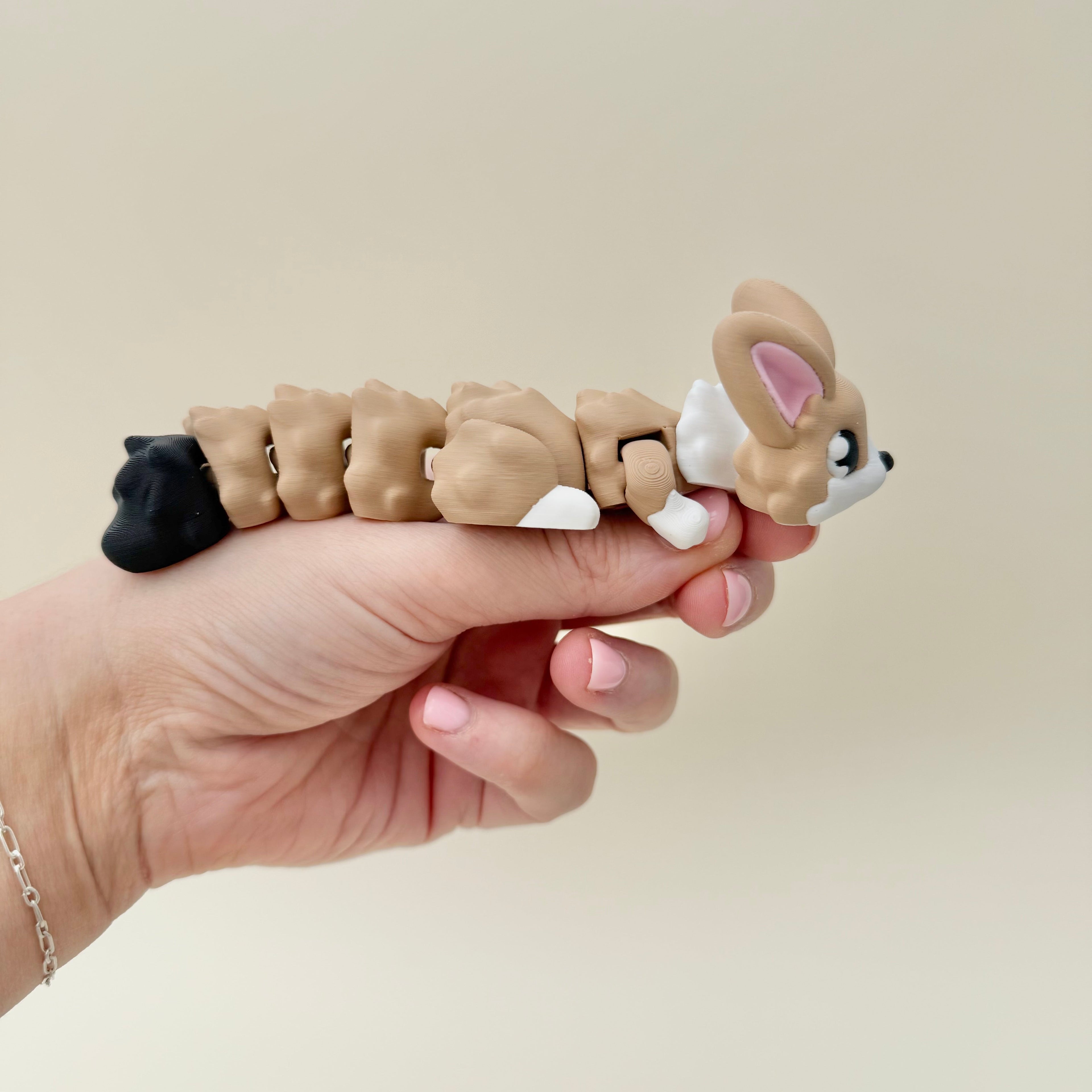 A silent sensory animal with flexible movement for subtle, calming fidgeting.
