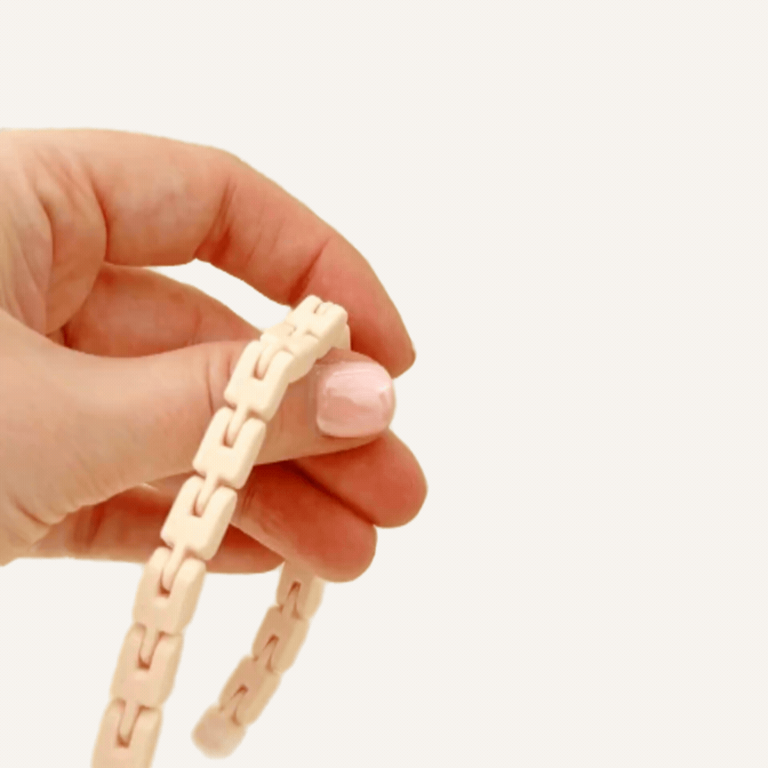 Smooth linked stim loop for discreet fidgeting, grounding, focus support and busy hands.