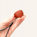 Compact sensory clicker with adjustable sound options and a textured top for tactile stimulation