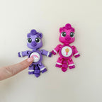 Novelty clicker toy for desk fidgeting, featuring flexi joints, personalised icon button and click or quiet click choice.
