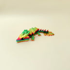 colourful articulated dragon toy with raised detailing for sensory input, suitable for focus breaks and desk play
