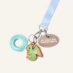 Communication tag with tactile text and silver loop for visible support on the go.
